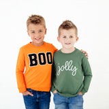 Boys wearing holiday themed sweatshirts. 