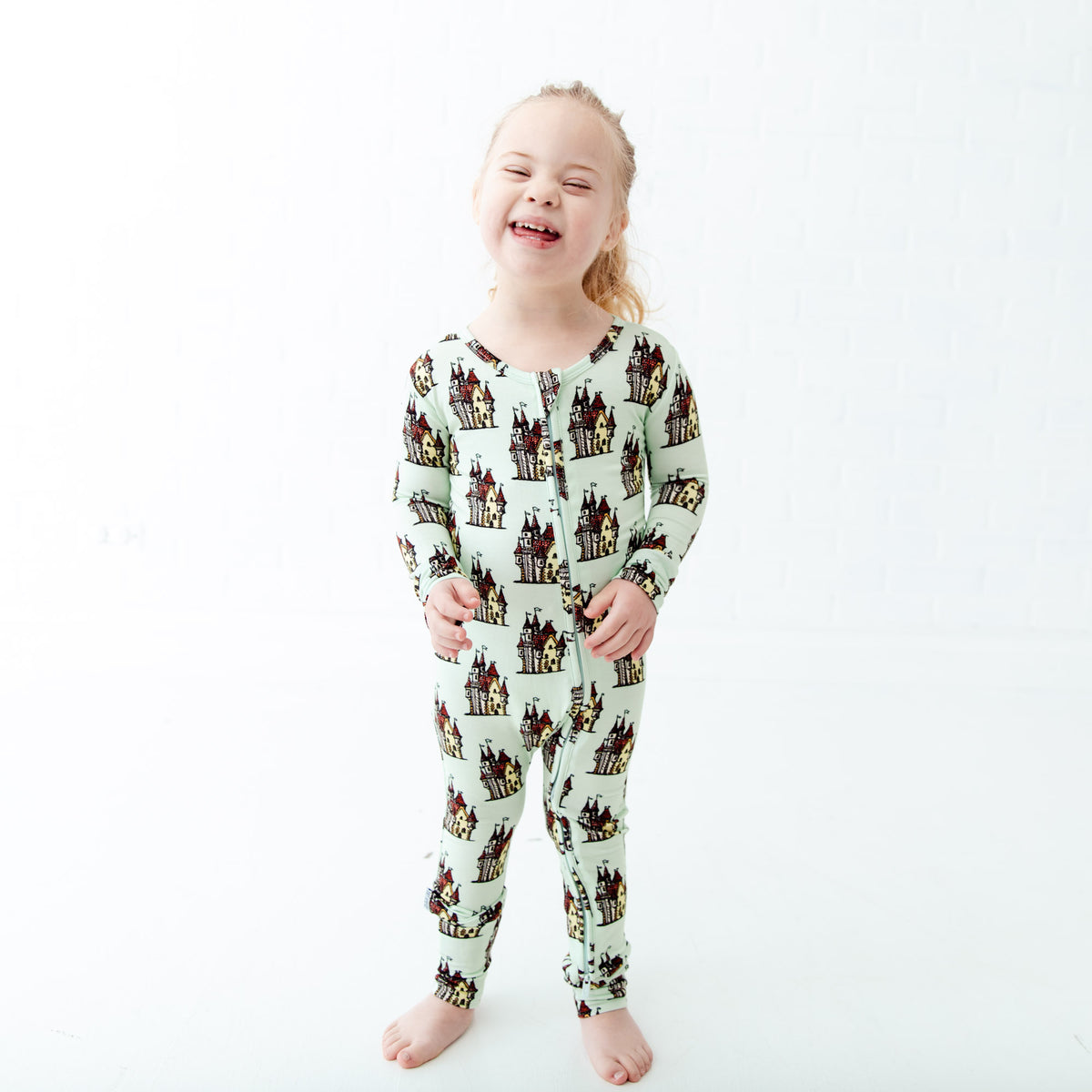 Convertible baby footie with whimsical castle print by Dreamiere