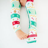 Child's feet in bamboo convertible footie pajamas.