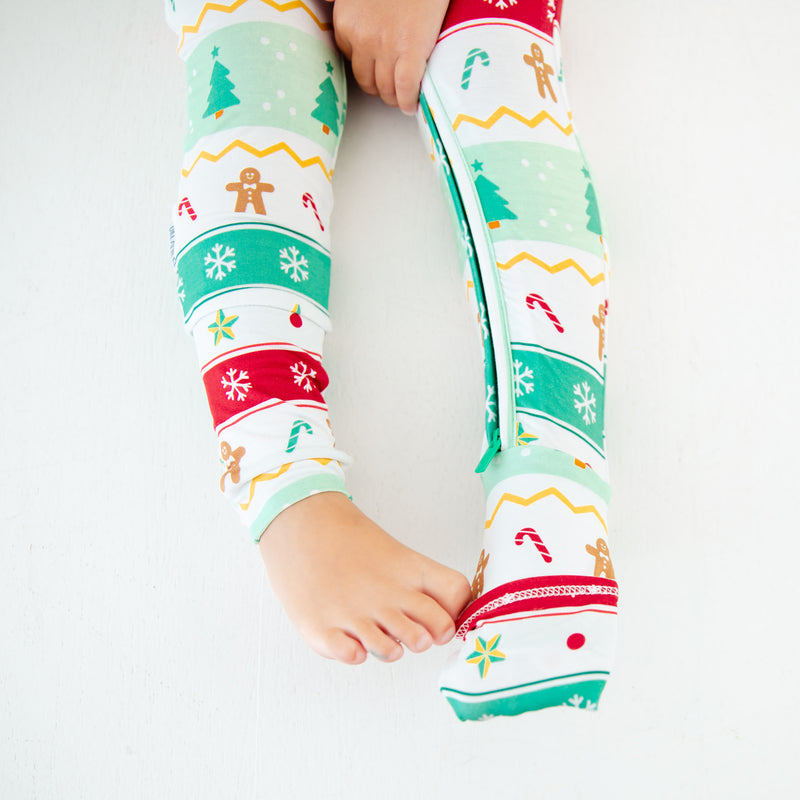 Child's feet in bamboo convertible footie pajamas.