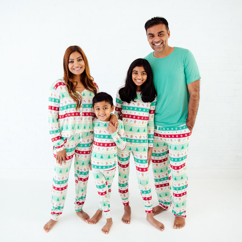 Family of four in matching mint holiday pajamas.
