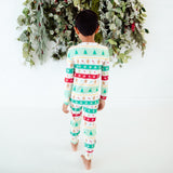 Back view of child in holiday bamboo print pajamas.
