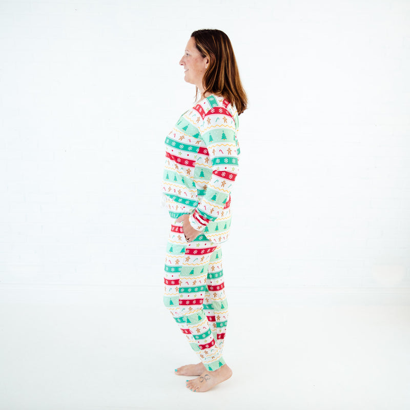 Woman wearing mint bamboo holiday themed pajamas.