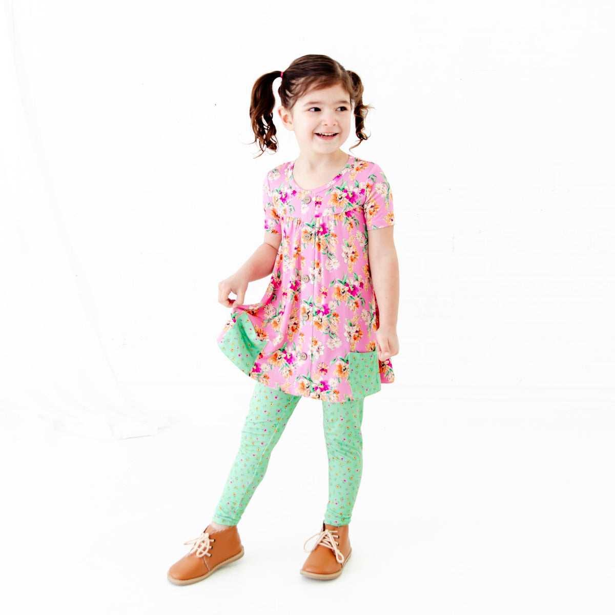 Girls' short sleeve pocket tunic and pants with pink floral design from Dreamiere