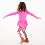 Child dancing in a retro holiday print outfit!
