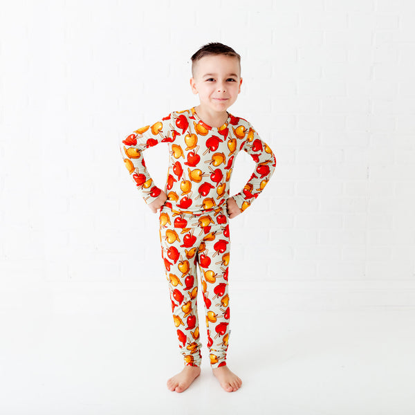 Child wearing bamboo pajamas with caramel apples. 