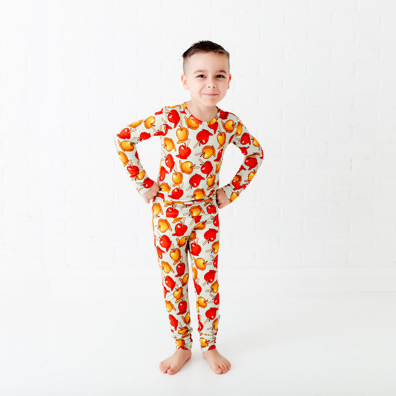 Child wearing bamboo pajamas with caramel apples. 