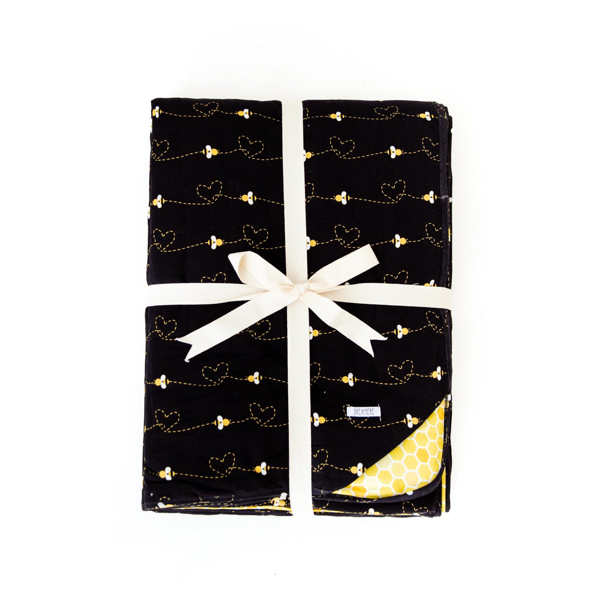 Quilted adult blanket with black bees pattern from Dreamiere