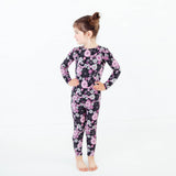 Young girl wearing spooky floral Halloween Pajamas.