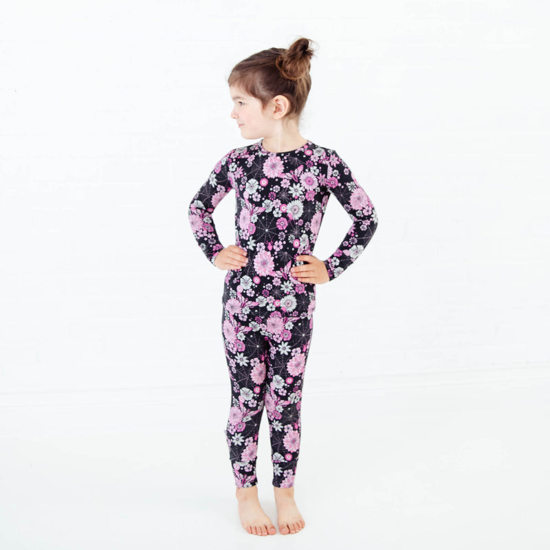 Young girl wearing spooky floral Halloween Pajamas.