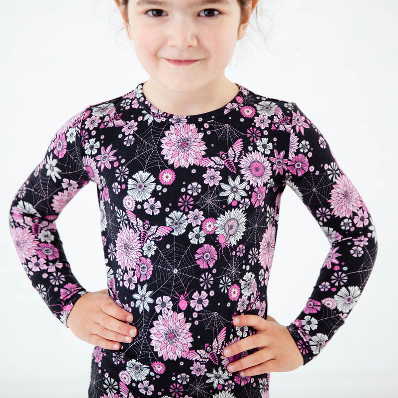 Close-up of black and pink Halloween pajamas.