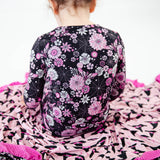 View of black and pink floral pajamas.