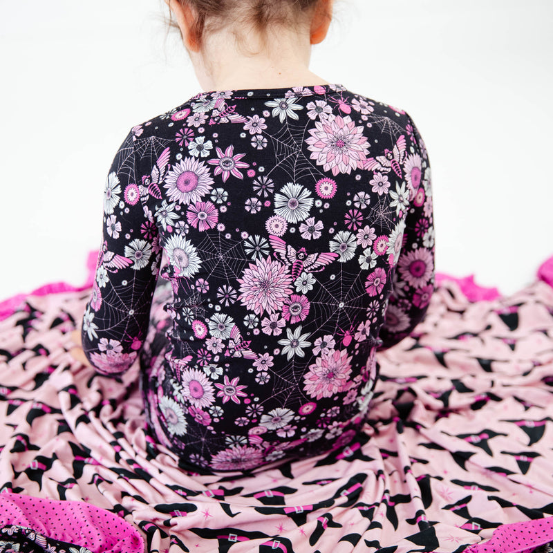 View of black and pink floral pajamas.