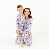 Mom and son wearing matching pajamas. 