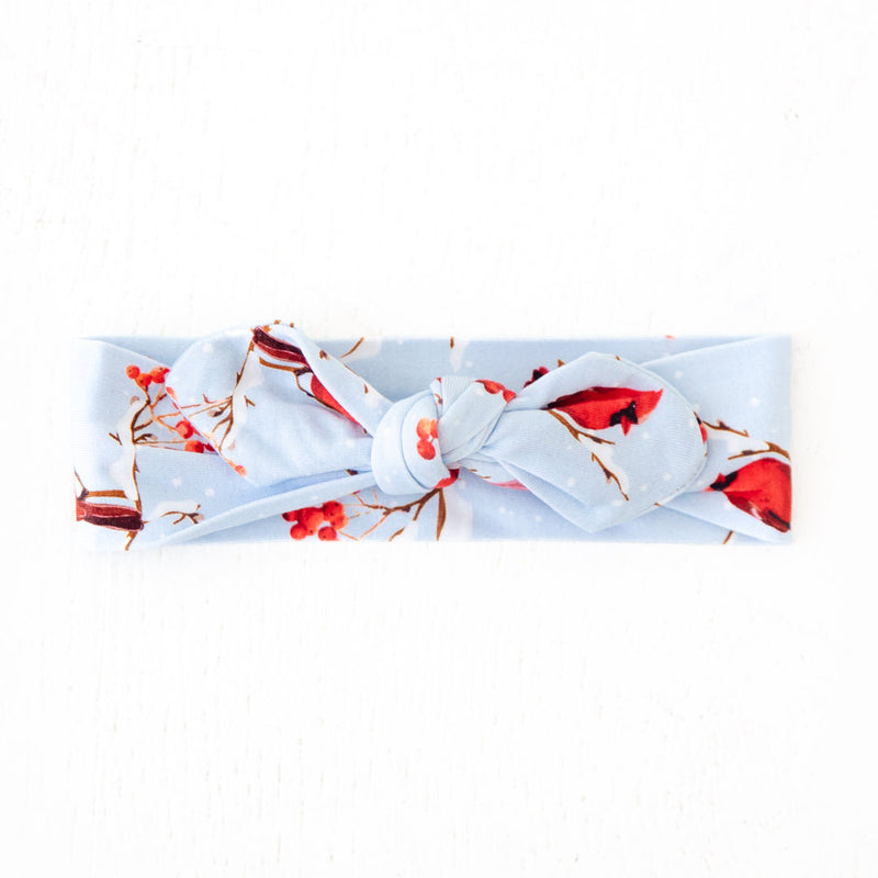 Knot headband with cardinal birds on it. 