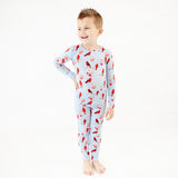 Little boy in Cardinal pajamas.