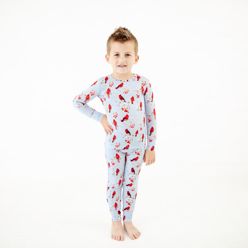 Child wearing Cardinal print bamboo pajamas.
