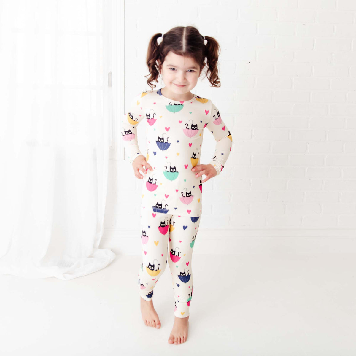 Kids’ two-piece pajamas with cat print from Dreamiere