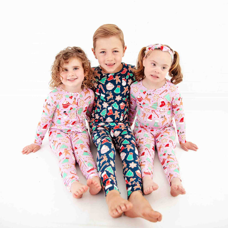 Siblings wearing coordinating Christmas Bamboo Pajamas.
