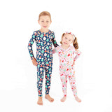 Boy and girl siblings wearing Christmas Pajamas.