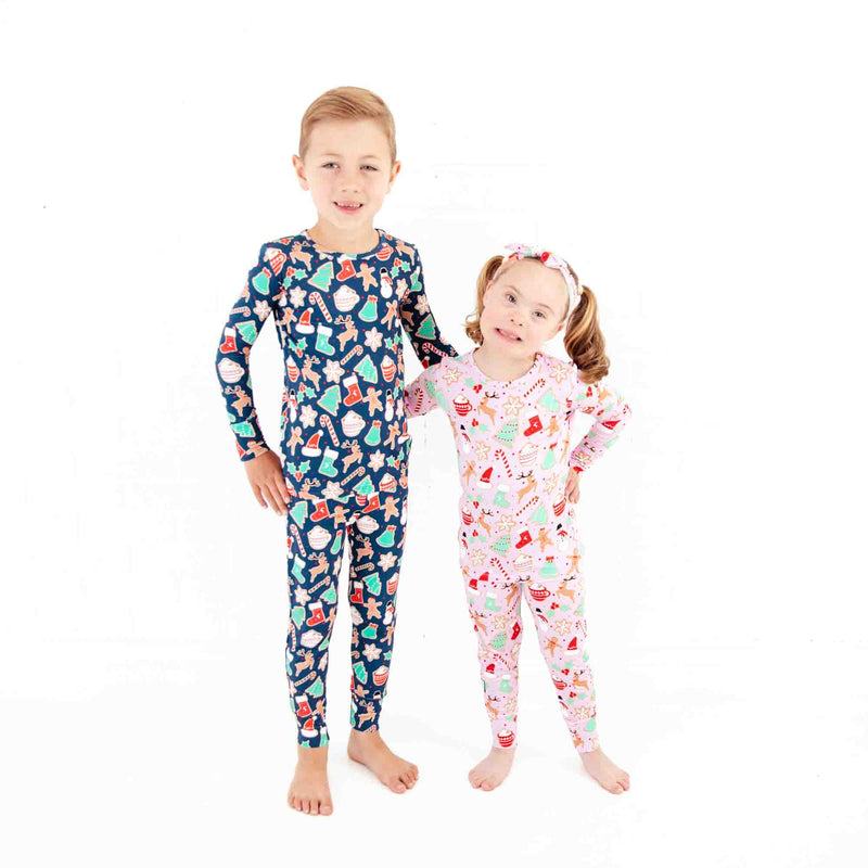 Boy and girl siblings wearing Christmas Pajamas.