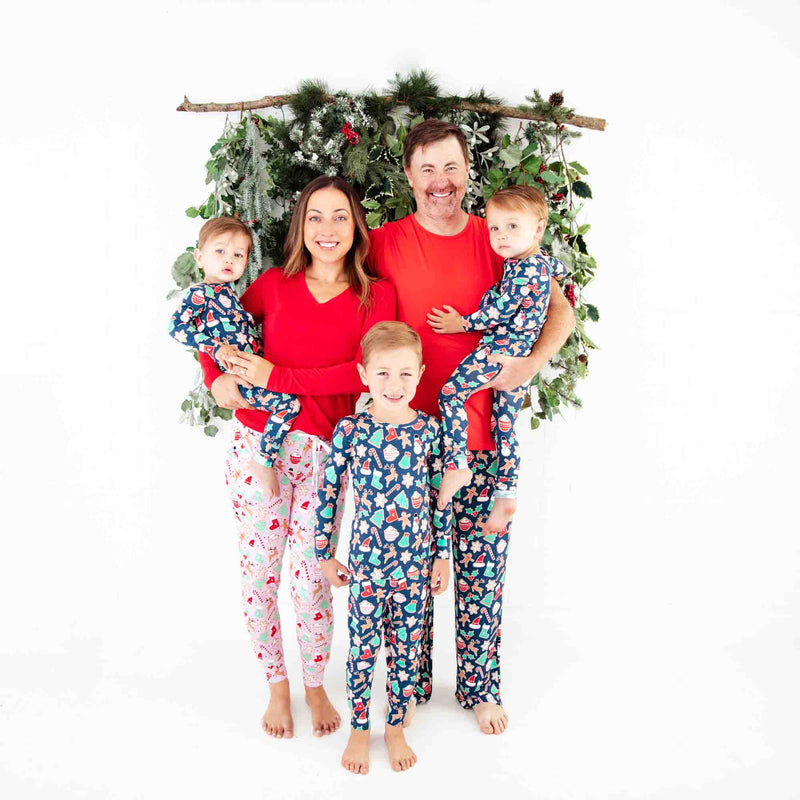 Family of five wearing matching Christmas Pajamas.
