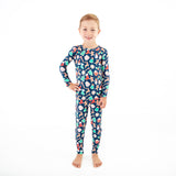 Boy in Navy Christmas themed bamboo pjs.