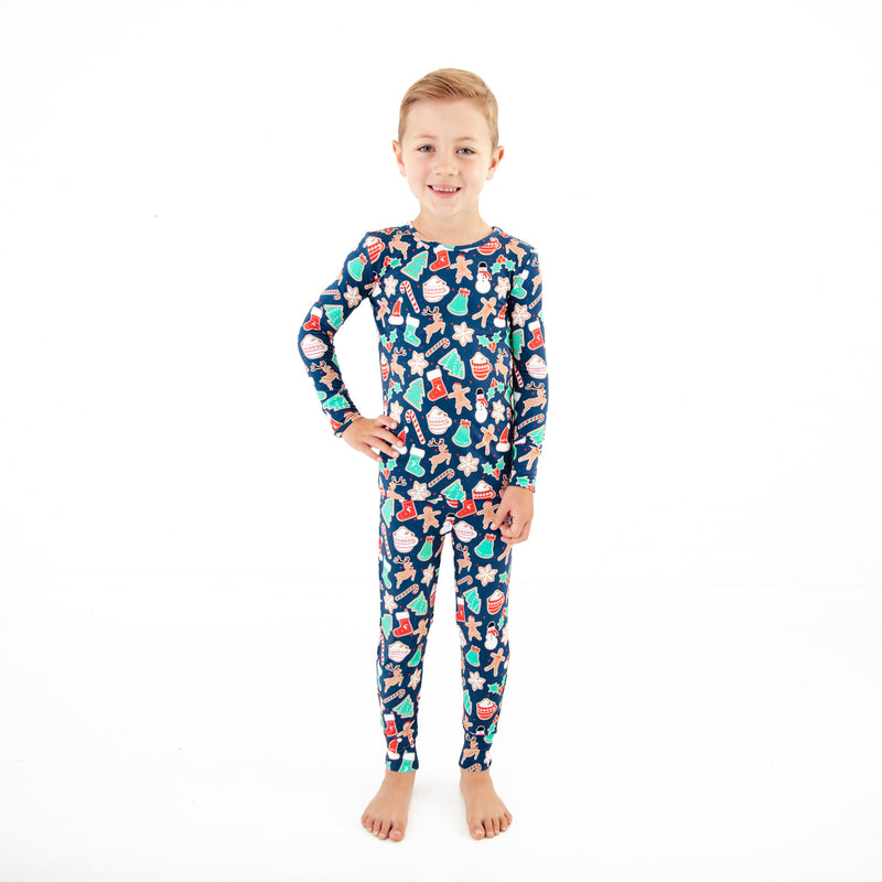 Boy in Navy Christmas themed bamboo pjs.