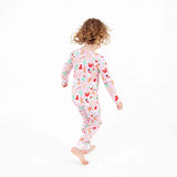 Girl dancing in Pink Christmas bamboo pajamas.
