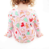 Toddler Girl sitting in Christmas Bamboo Pajamas.