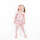 Girl wearing Christmas bamboo Pajamas in Pink. 