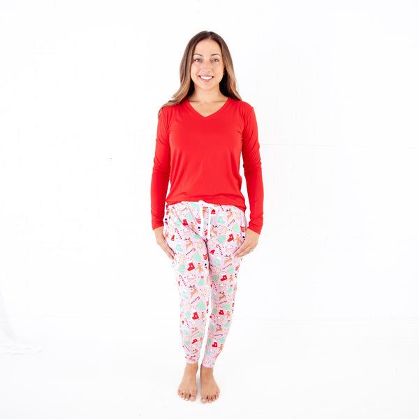 Woman wearing Pink and Red Christmas Pajamas.