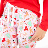 Close-up of Pink and Red Christmas Pajamas pants.