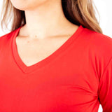Red V-neck bamboo pajamas shirt on woman.