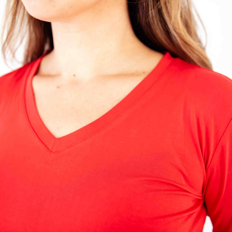 Red V-neck bamboo pajamas shirt on woman.