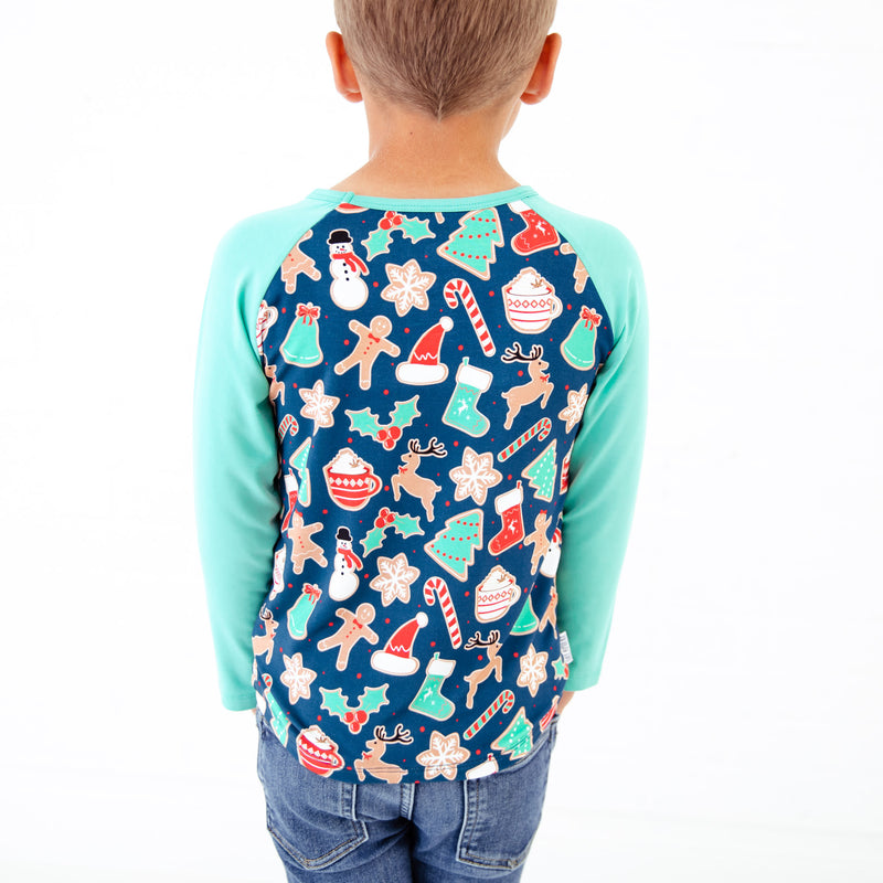 Boy wearing a Navy Christmas themed Raglan.