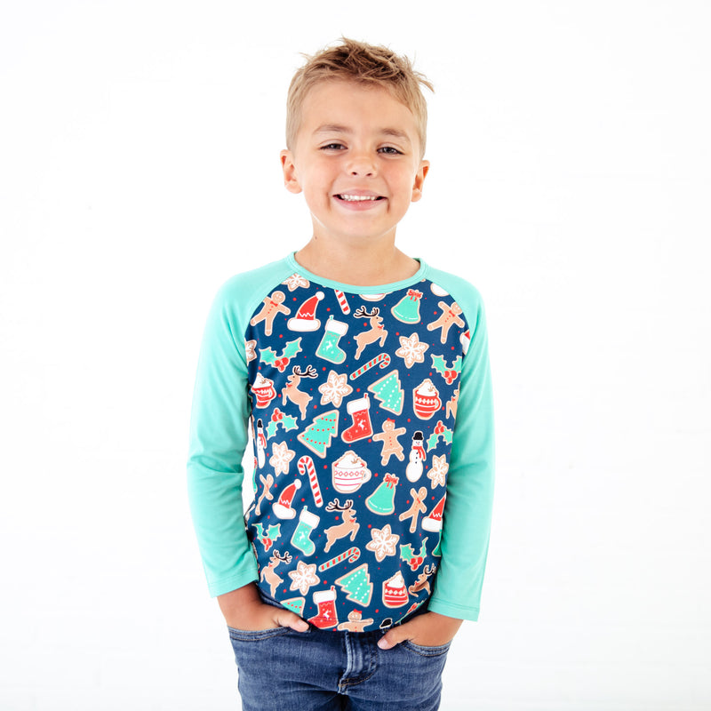 Young boy wearing a Christmas Themed Ragland.