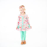 Young girl wearing pink Christmas Bamboo Outfit. 