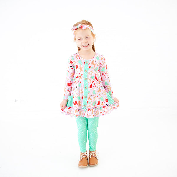 Young girl wearing pink Christmas Bamboo Outfit. 