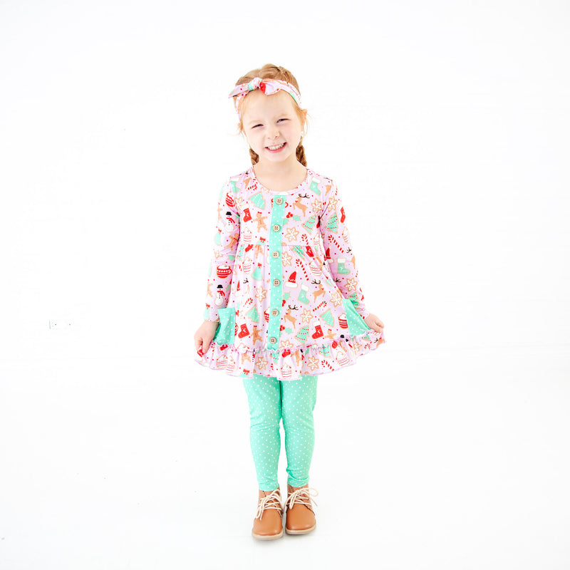 Young girl wearing pink Christmas Bamboo Outfit. 