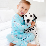 Dalmatian and boy wearing dalmatian themed bamboo footie