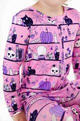 Halloween zipper pajamas in pink and purple.