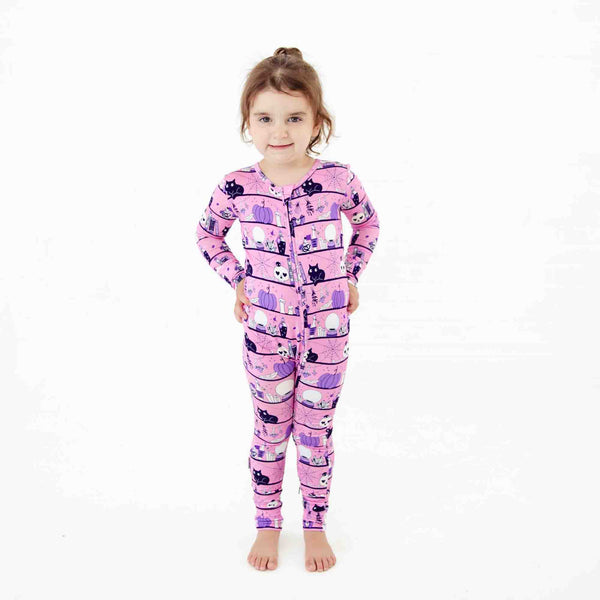 Little girl in pink halloween pajamas. 
