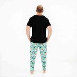 Man in teal and black halloween pajamas. 