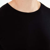 Man in a black bamboo loungewear Shirt. 