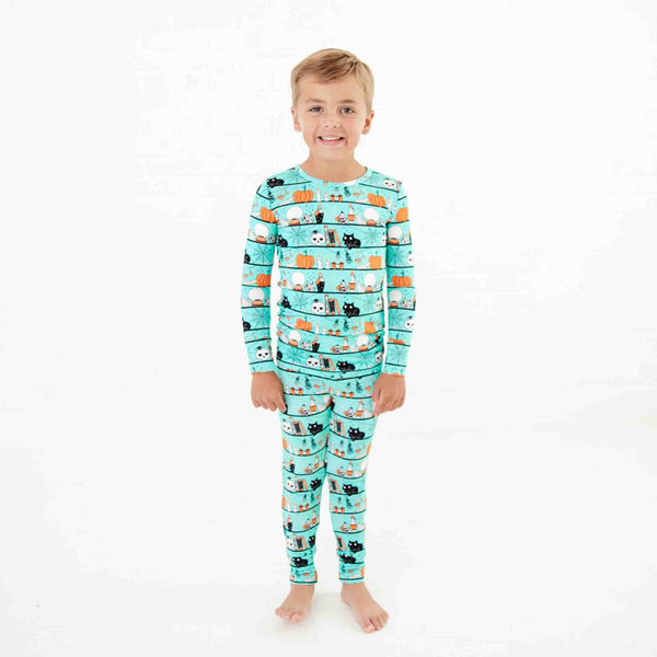 Child wearing Teal Halloween Bamboo Pajamas. 