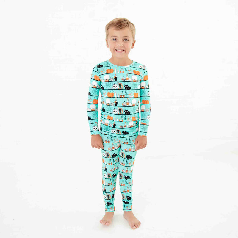 Child wearing Teal Halloween Bamboo Pajamas. 