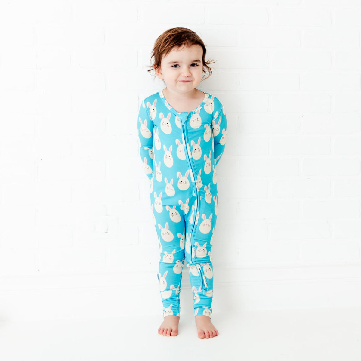 Baby footie with pastel Easter egg pattern by Dreamiere