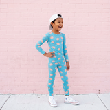 Child wearing a pigs two piece pajama set.