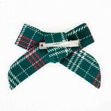Back and clip of a plaid hair bow. 